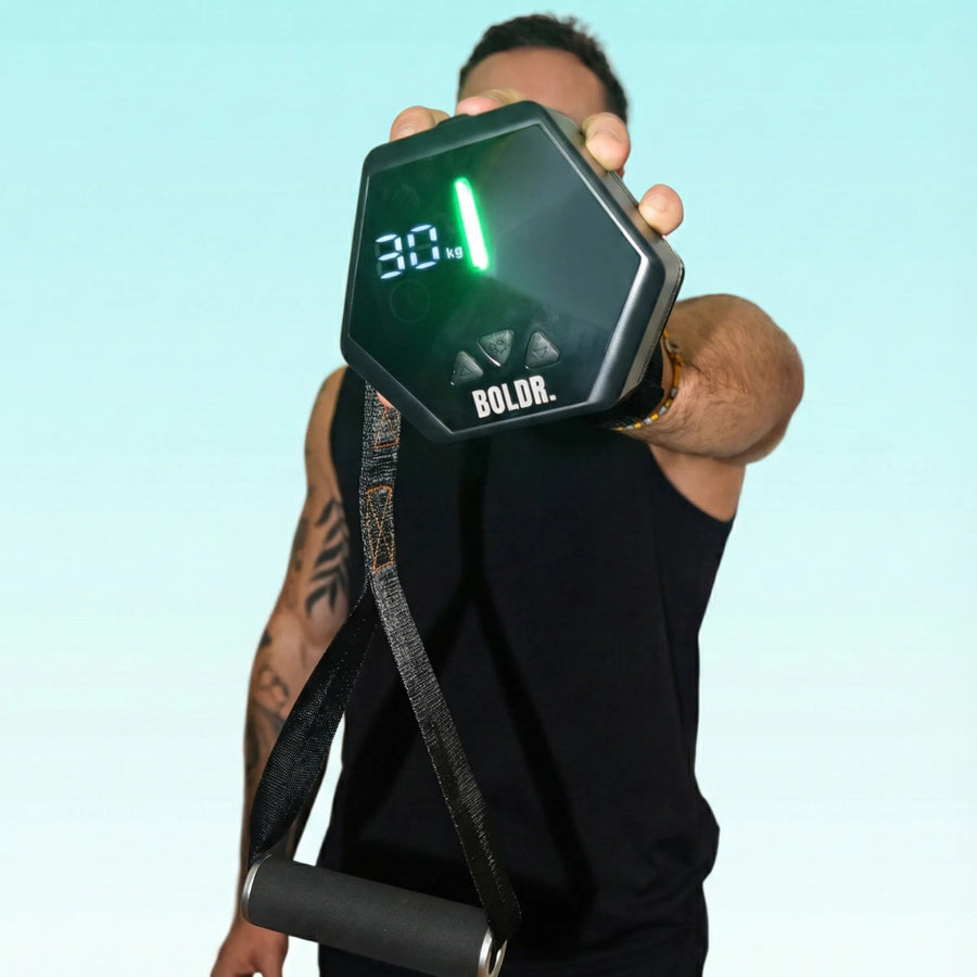 Man holding BOLDR device with one hand.